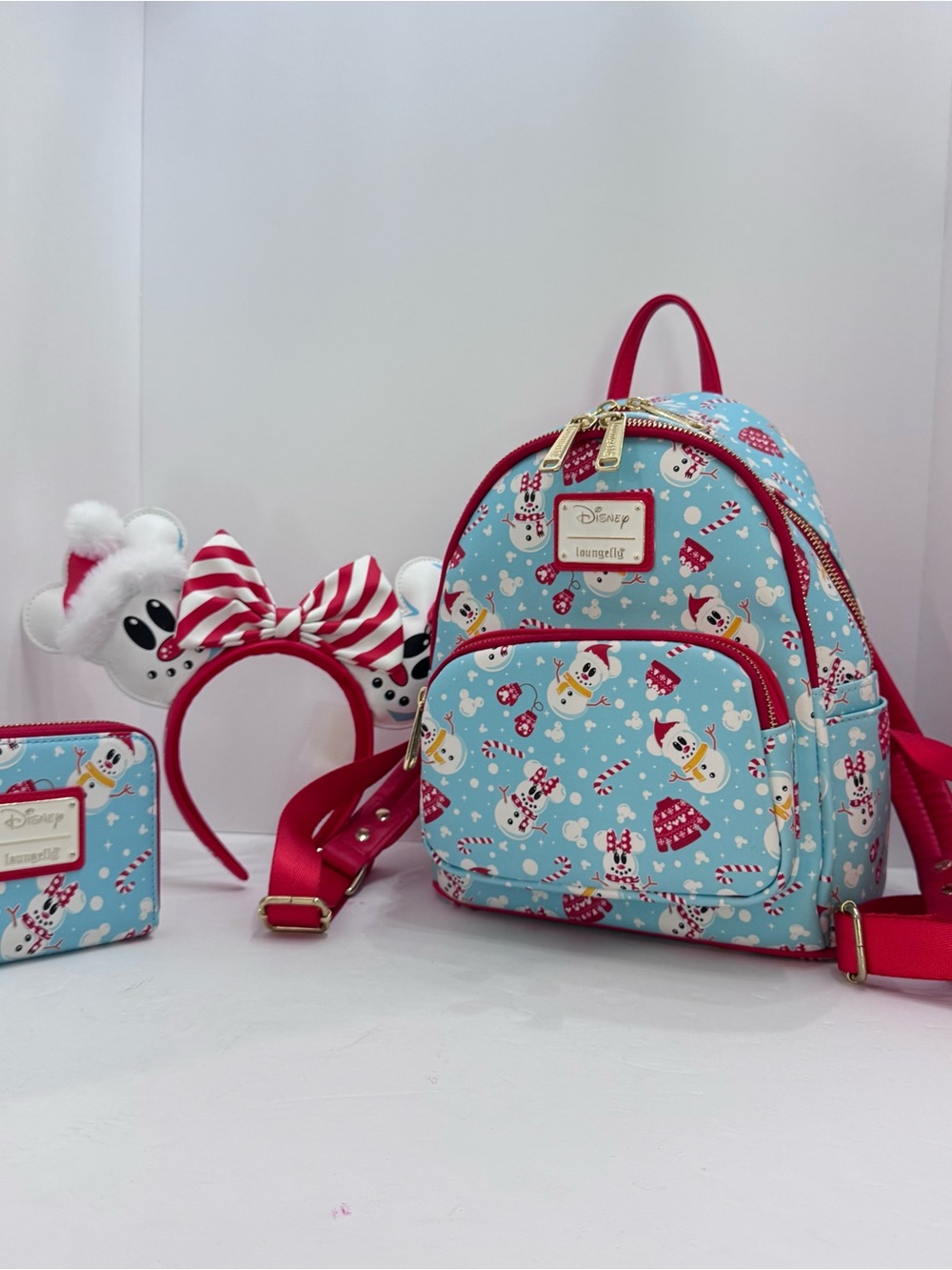 Loungefly Disney Mini Backpack in Light Blue with Pink Accents and Snowman Print